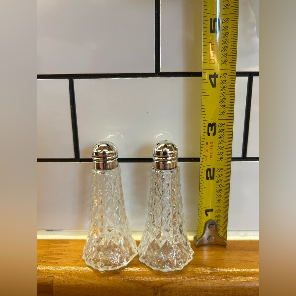 Vintage cut crystal with sterling silver top salt and pepper shakers.